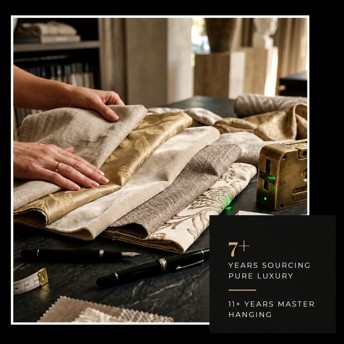 Hands sorting drapery fabric samples and a tape measure at Dream Wall Studio
